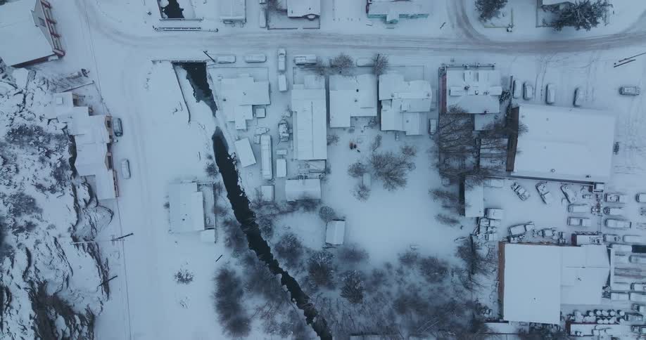 Birds eye view of a small town in winter is displayed