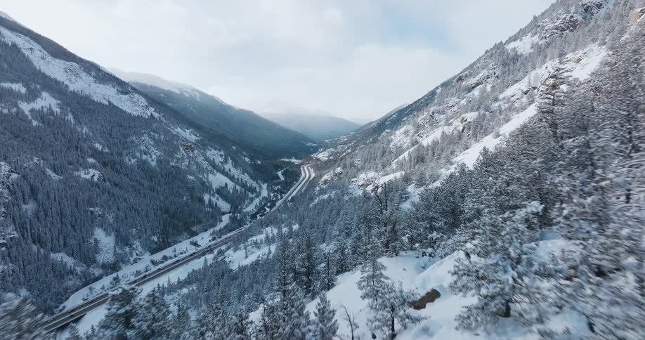 Aerial view of snowy mountains is displayed during the day
