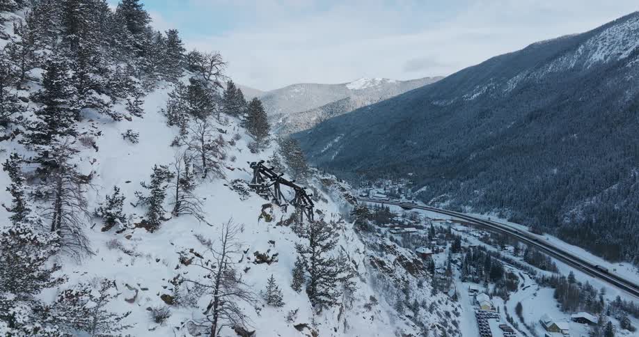 Aerial view of snow covered mountains are displayed