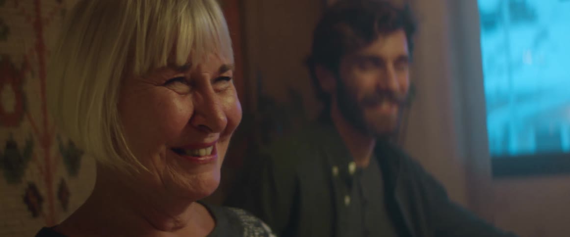 Man and woman are talking in a room together