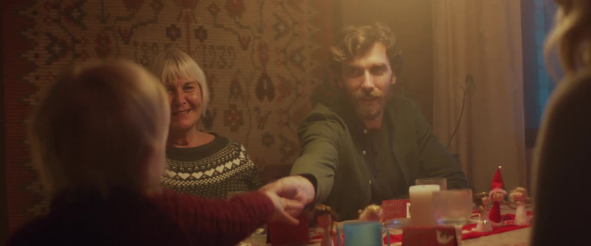 A family have dinner together at home
