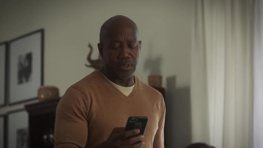 Three people are in a house and texting on their cellphones