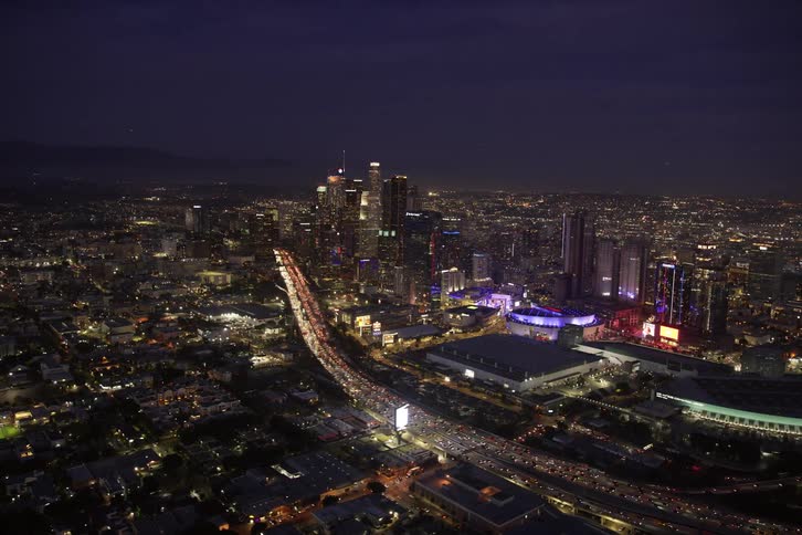 Aerial view of illuminated high rise buildings and skyscrapers in the city at night