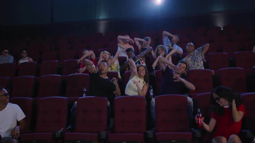 The audience in the theater are dancing