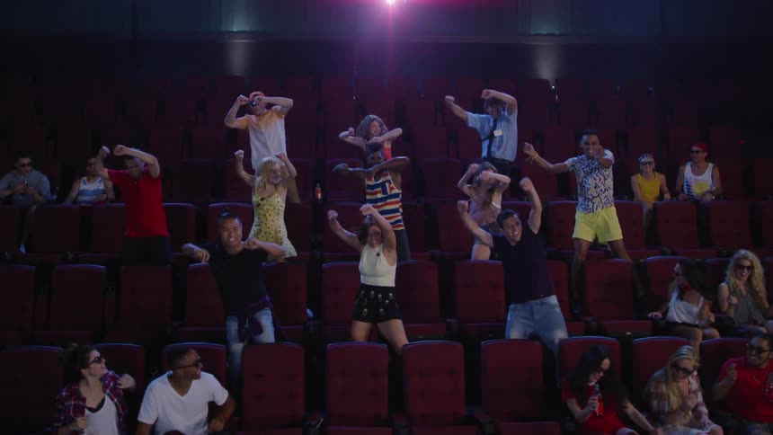 Dancers perform in a movie theater