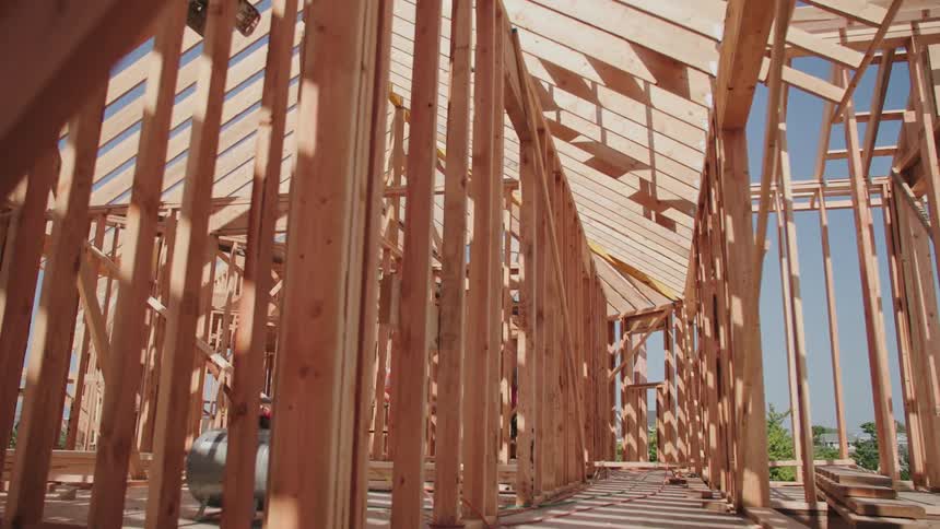 The wooden beams are set up on the house