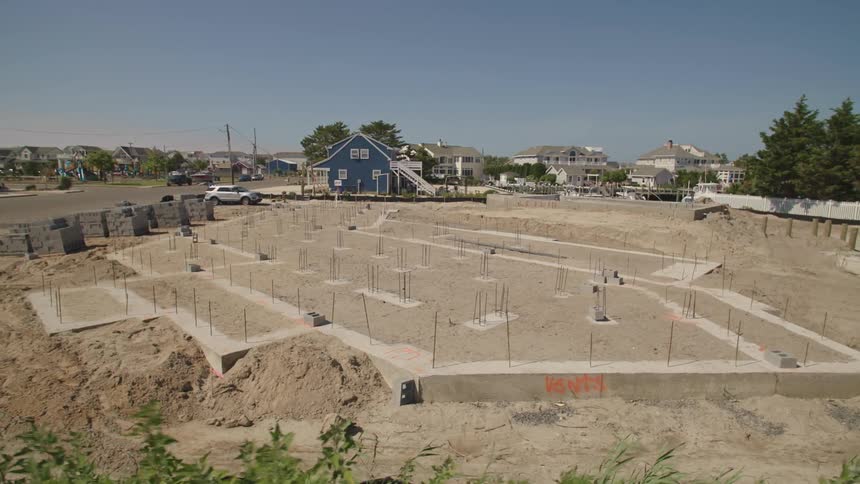 An empty lot under construction in a neighborhood