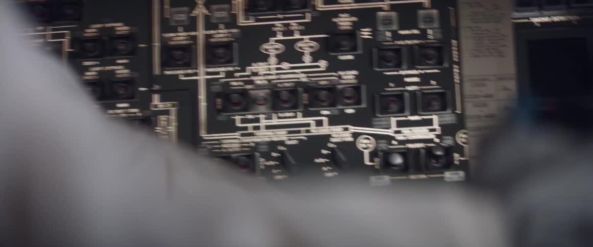 The person is steering in the cockpit which is shaking