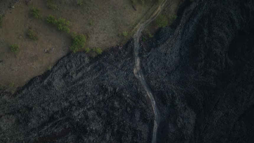 A trail runs up the hill