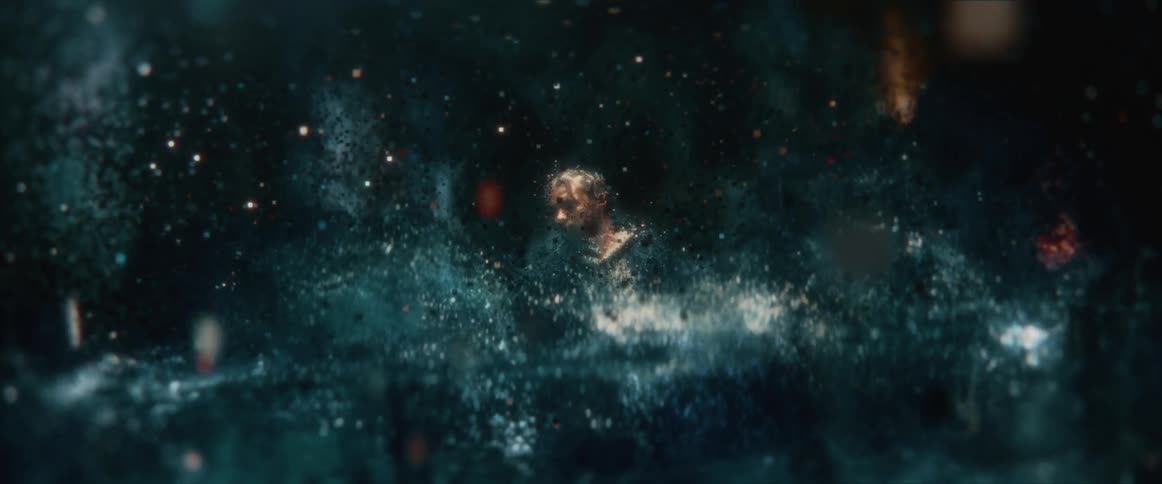 A partially digitized man is floating in an environment of reflective squares and bits in the darkness as if he was in a matrix