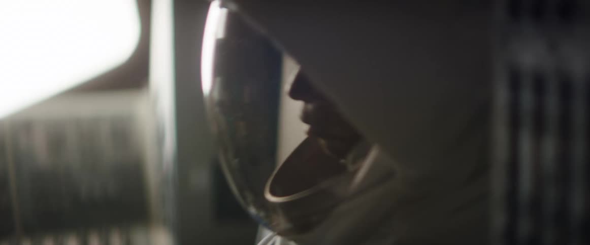 An astronaut sits in a space shuttle during take off