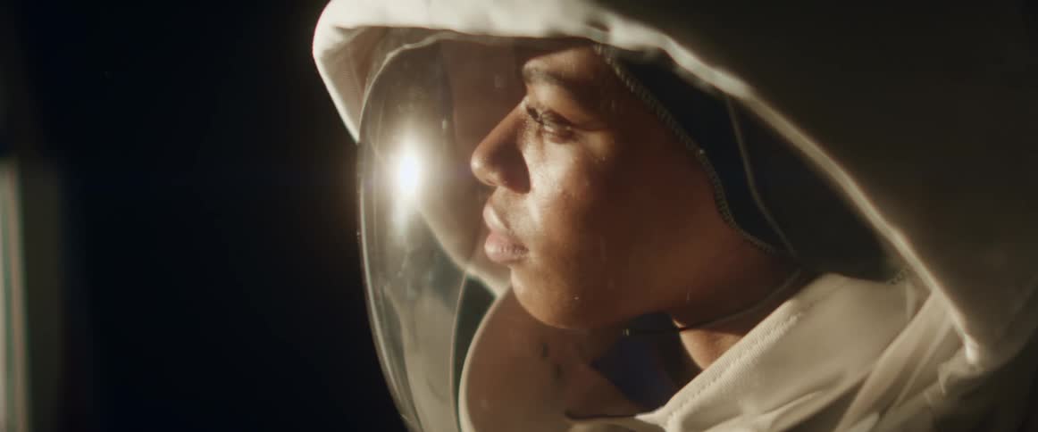 The light reflects off the space helmet