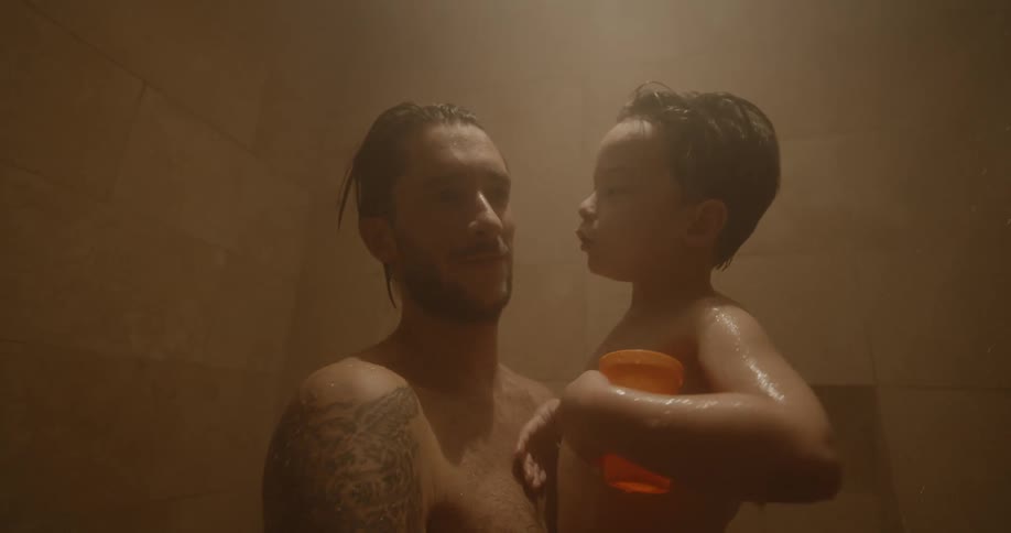 A father and son shower together