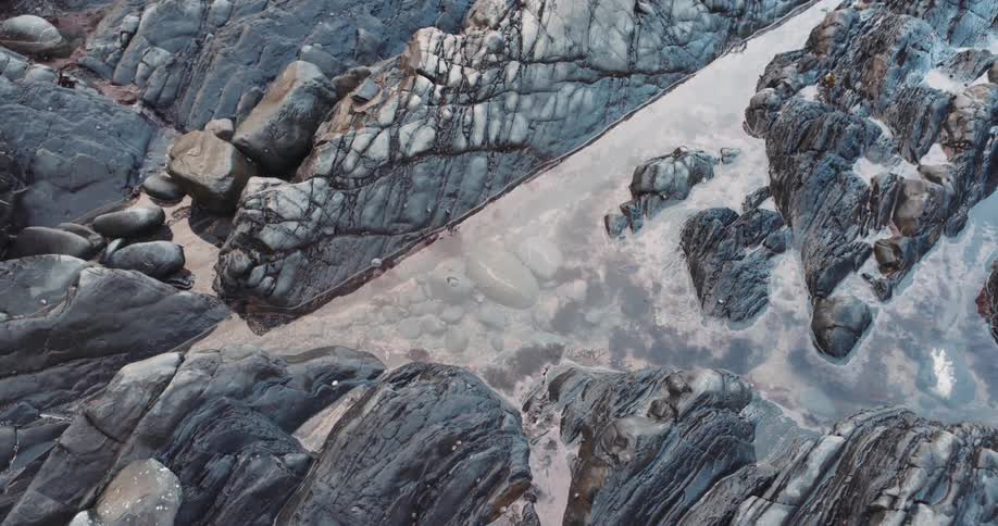 An aerial view of a rock formation on a cliff