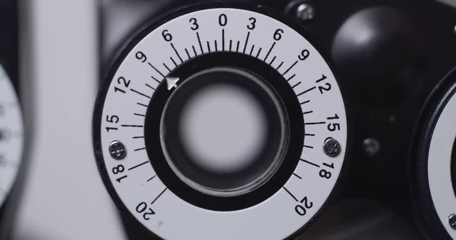 A lens moves on a device used to measure lenses