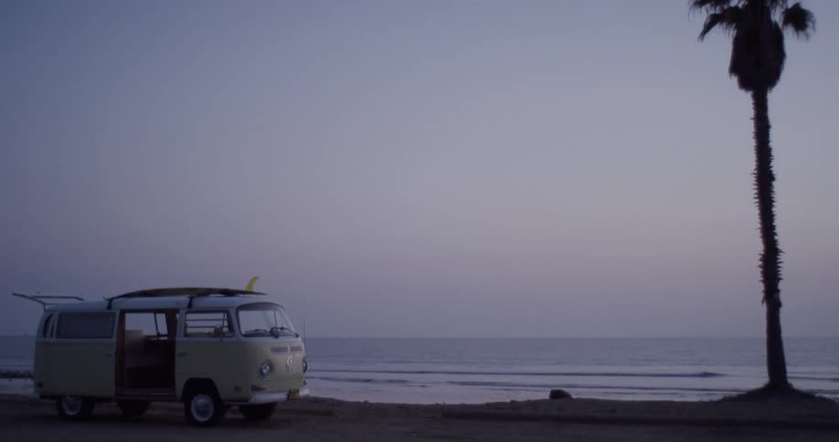 The van is parked by the water