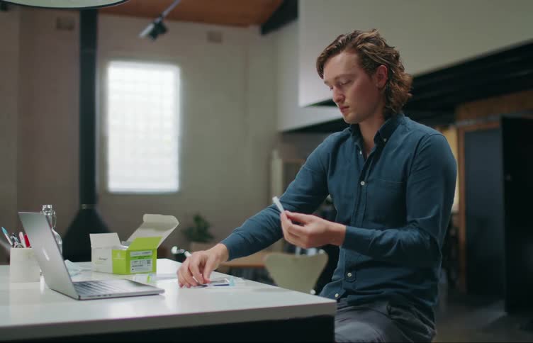 A man looking at a test in a house