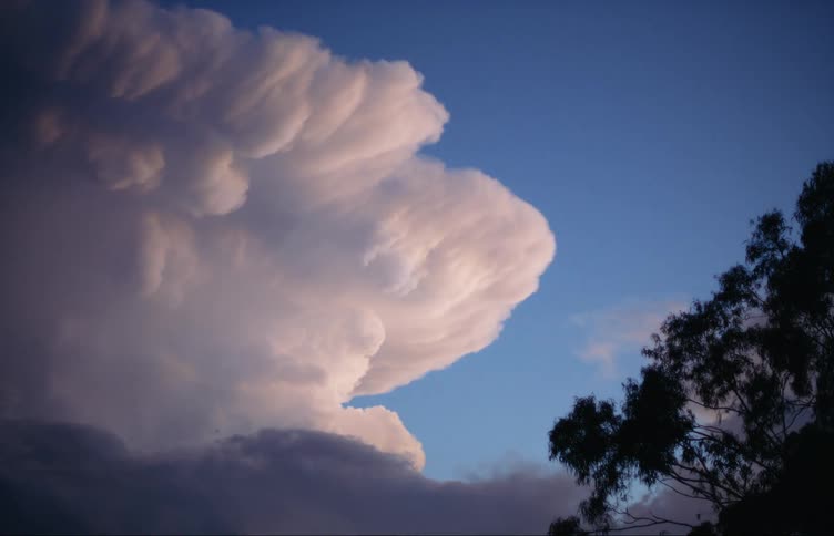 Lightning strikes in sky as storm front fills part of sky