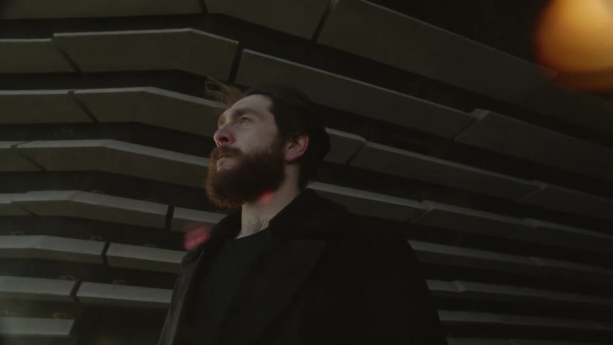 A man standing outside of a building
