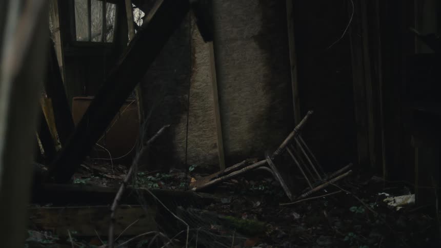 A view of an abandoned house with furniture