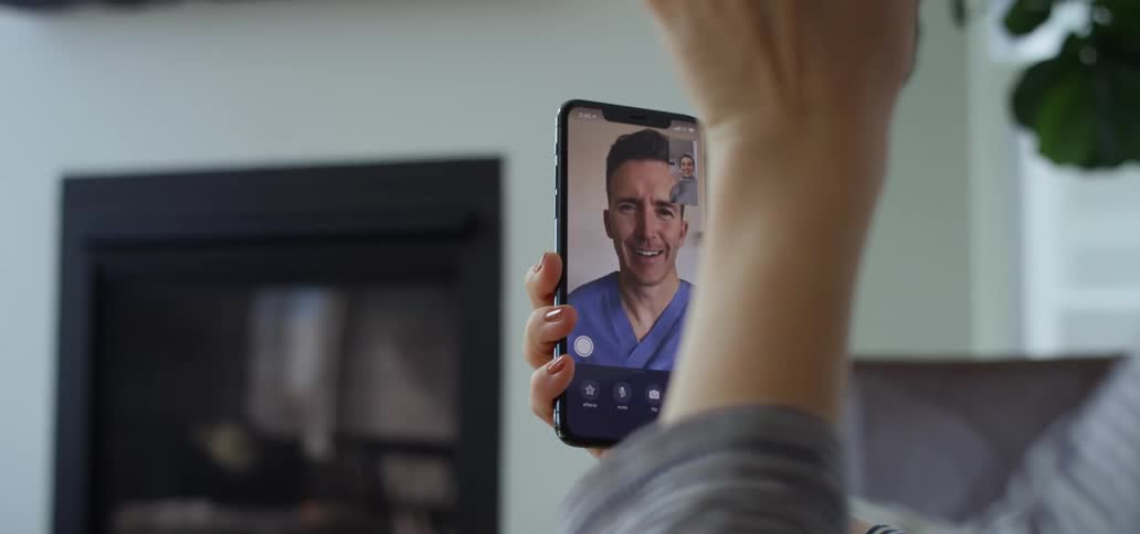Two people talk on video phone
