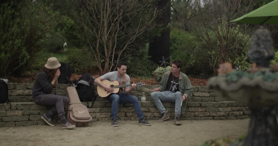 Group of people playing musical instruments outside