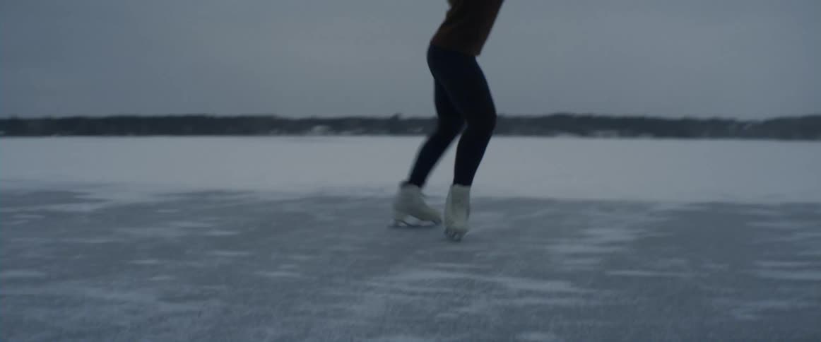 A woman ice skating and dancing