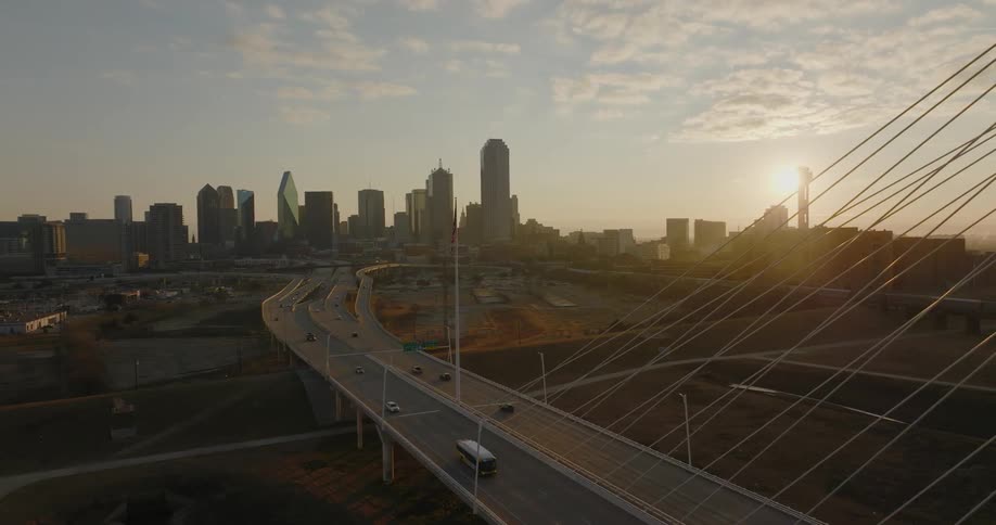 Vehicles travel on the highway towards the city