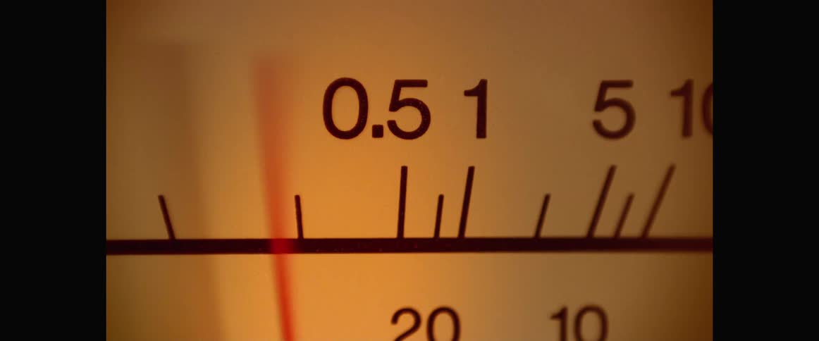 The red needle on a meter jumps back and forth quickly