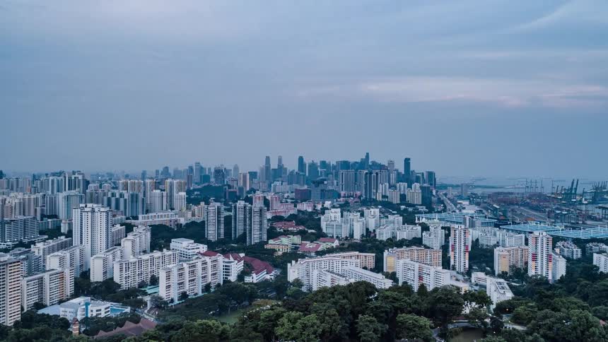 People travel in the park on the hill by the city