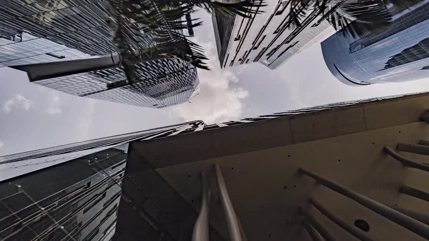 The tall buildings have reflecting sides