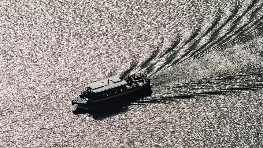 A ferry travels in the water