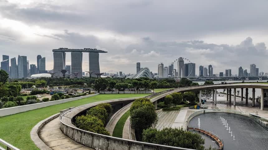 People walk around the park by the city