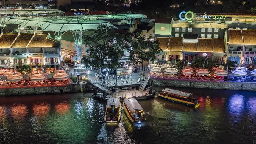 River taxis nearly collide as they park on a pier