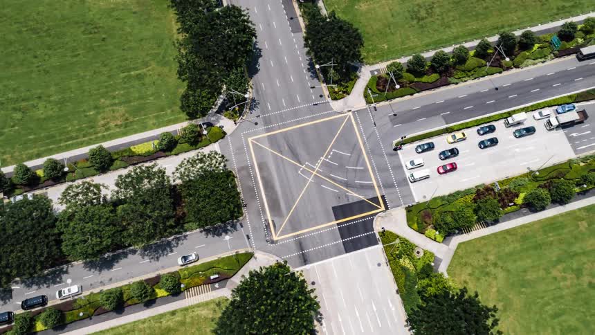 Aerial view of vehicles driving at intersection