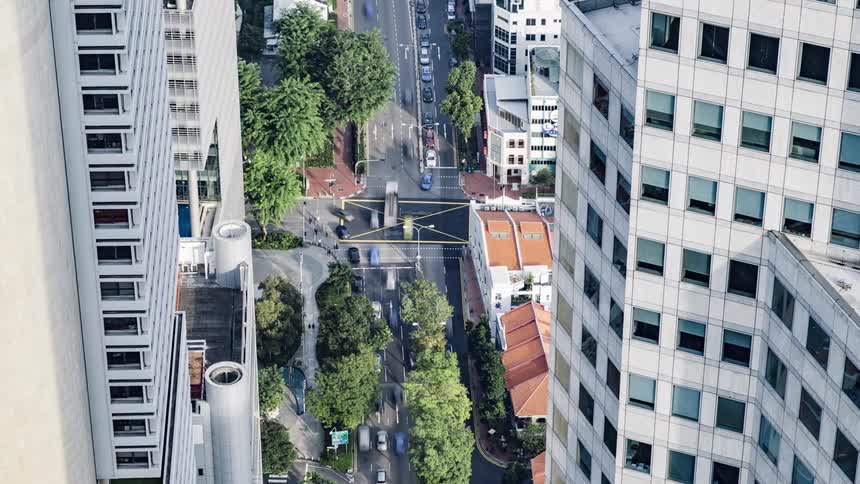 Time lapse of vehicles moving over an intersection in the city downtown