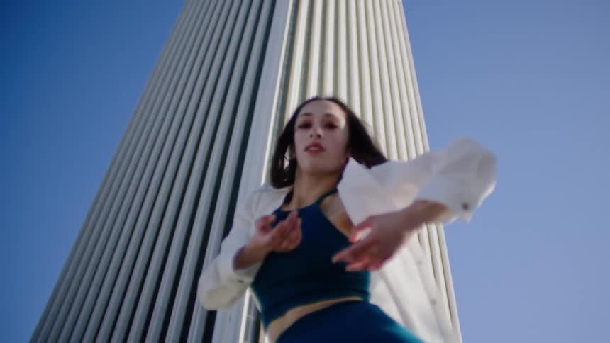 A woman dancing outdoors