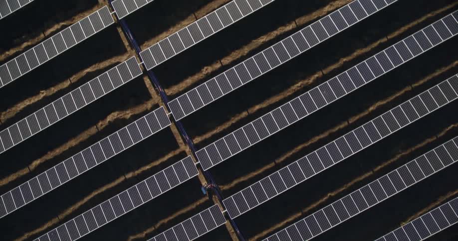 Aerial view of solar panels in field