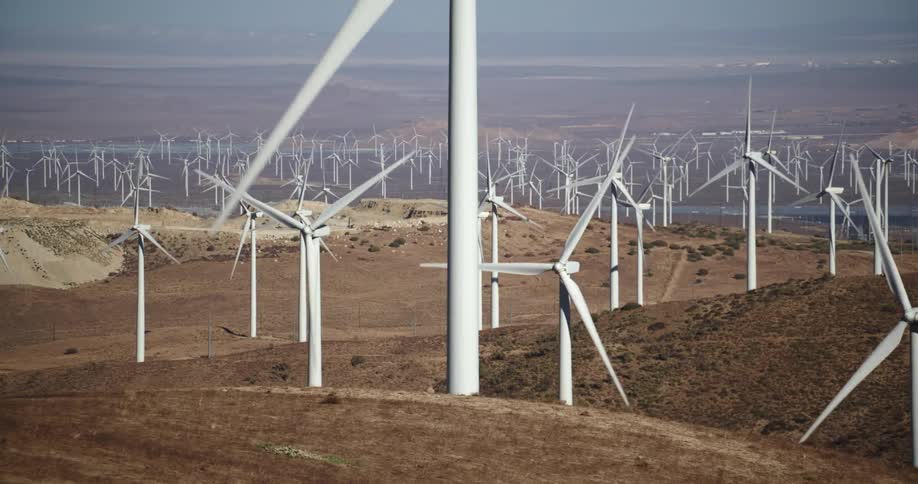 Wind turbines run on wind farm in the hills