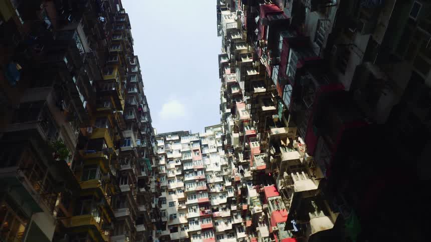 Large apartment building with many apartments with balconies