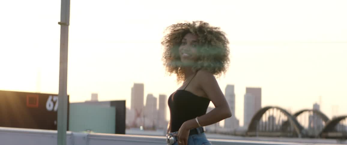 A woman is posing for pictures on the roof