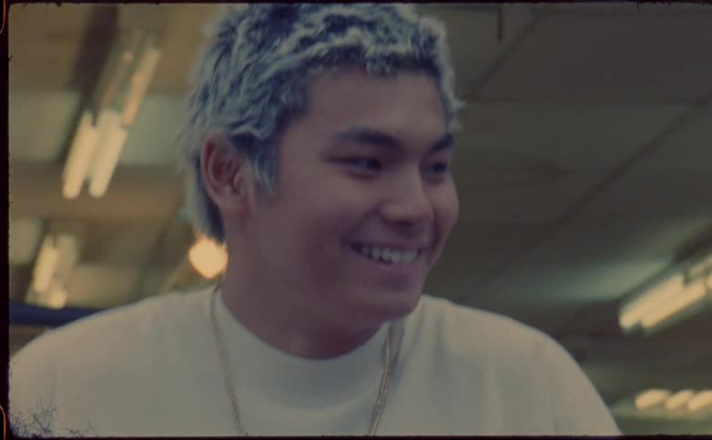 A teen makes a surprised face while laughing with a friend