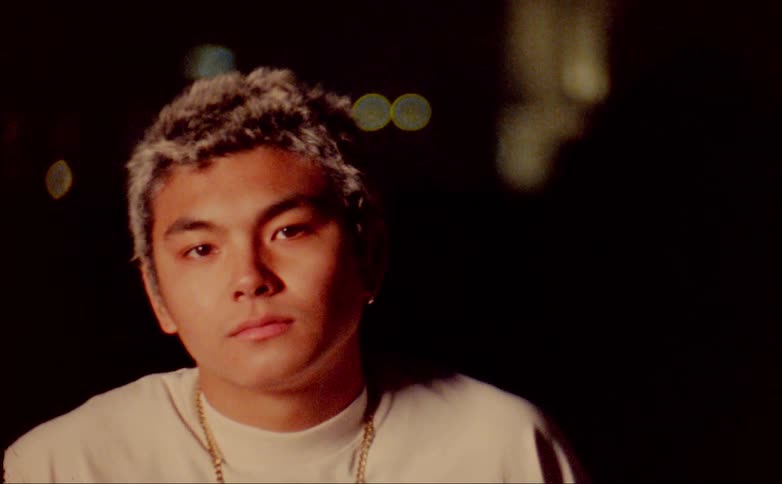 A portrait of a man outdoors at night