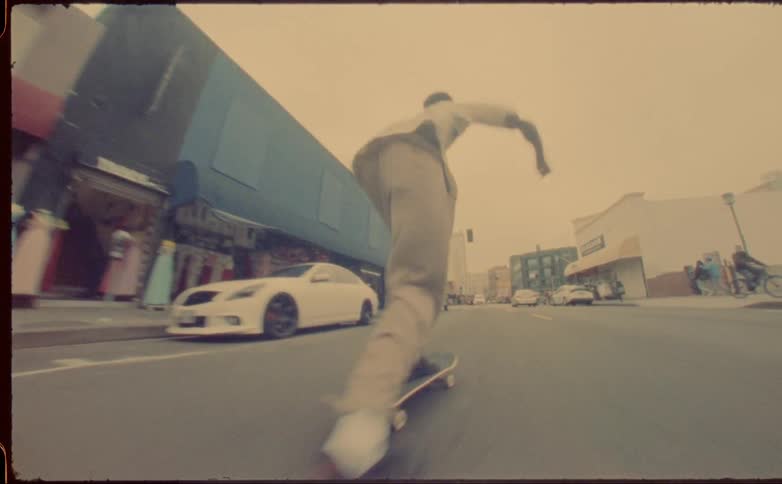 Two friends skateboard on highway in the city