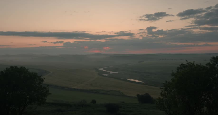 A view of a sunset over a landscape