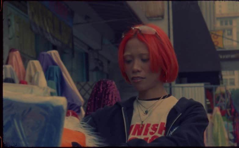 A teenage girl bags an order at a store