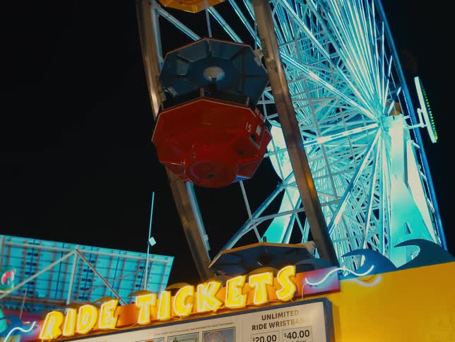 Ferris wheel in amusement park at night