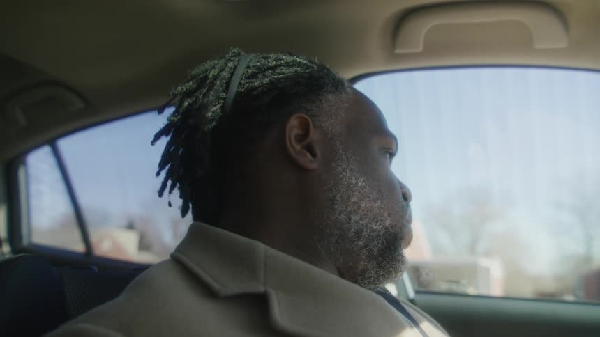 A man shouts in his car