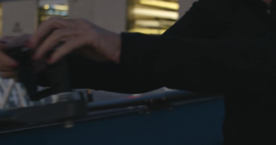 A person is turning the levers on the vices