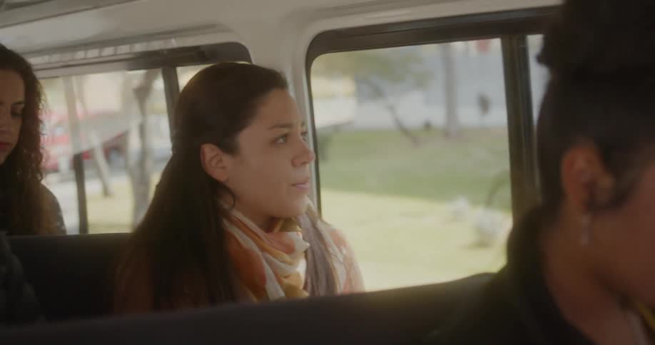 A group of women riding on a bus